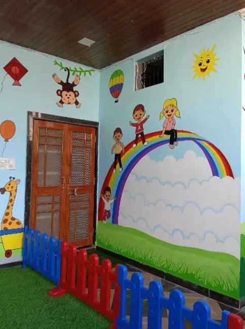 Bright play area with rainbow wall art